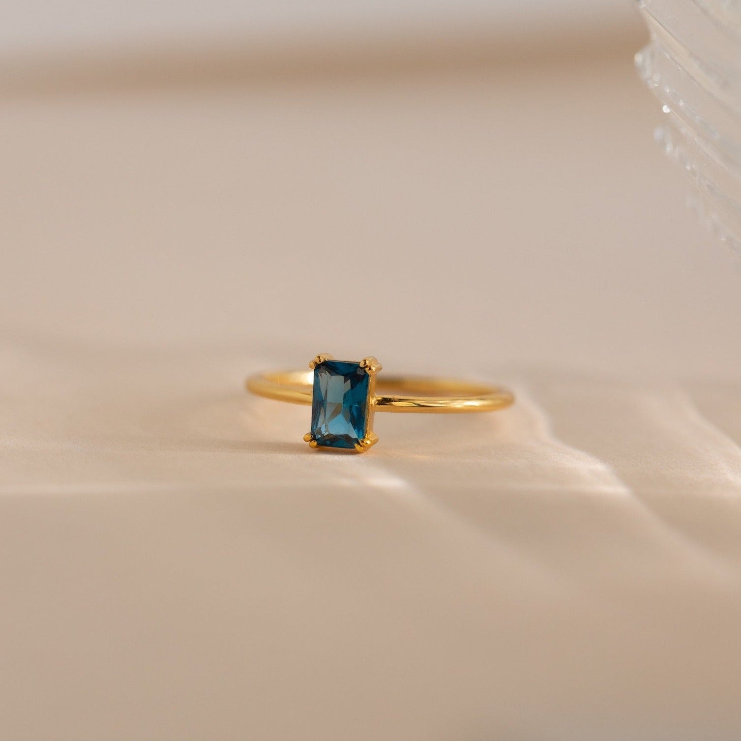 Embrace Vintage Elegance with the Blue Topaz Emerald Ring
